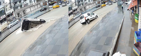 Otomobil sağanak yağıştan dolayı çöken yola düştü