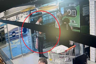 Yüzlerce paket sigarayı çantasına doldurdu, marketten böyle kaçtı!